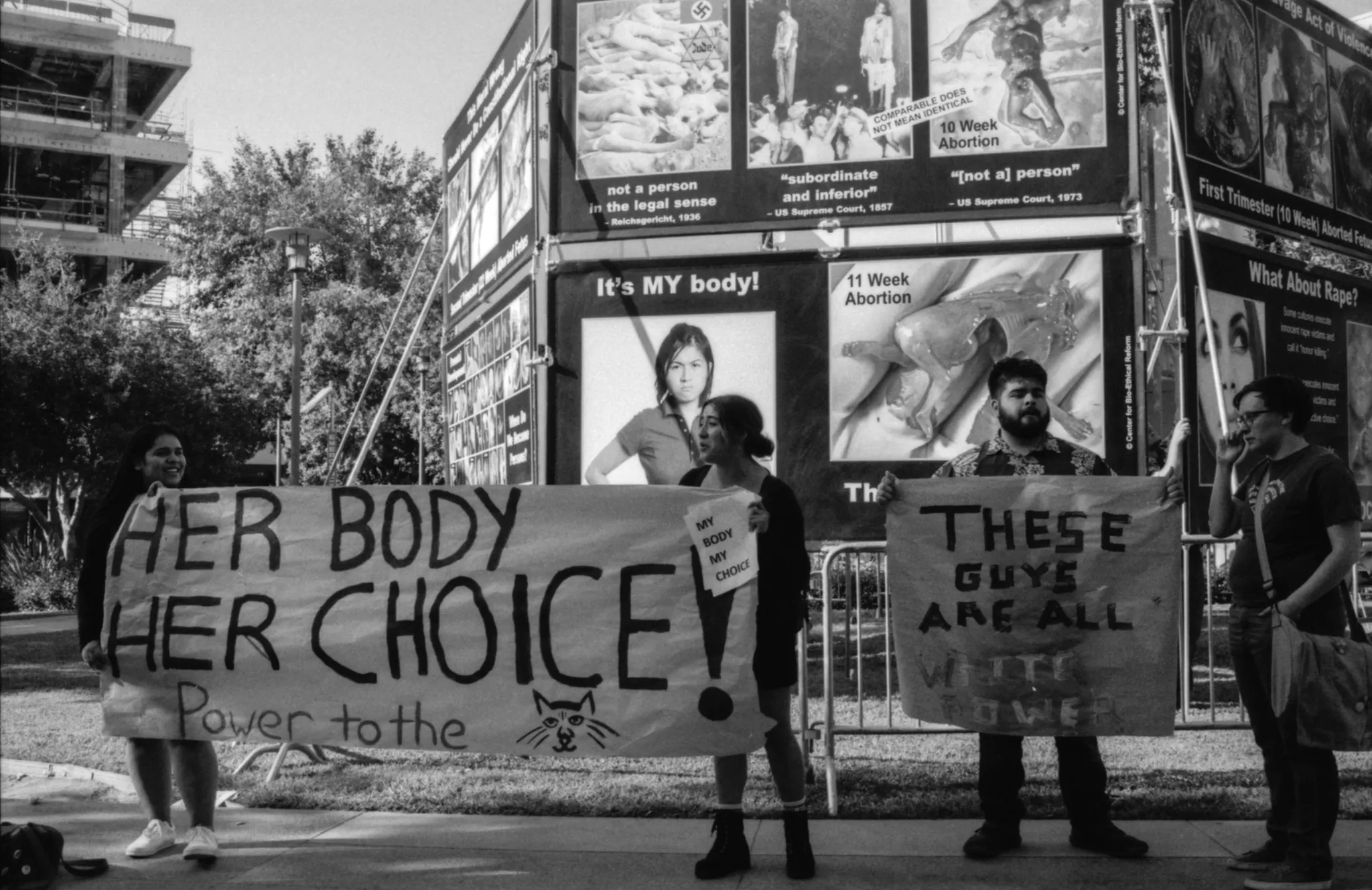 Pro-choice advocates holding up a "Her Choice"