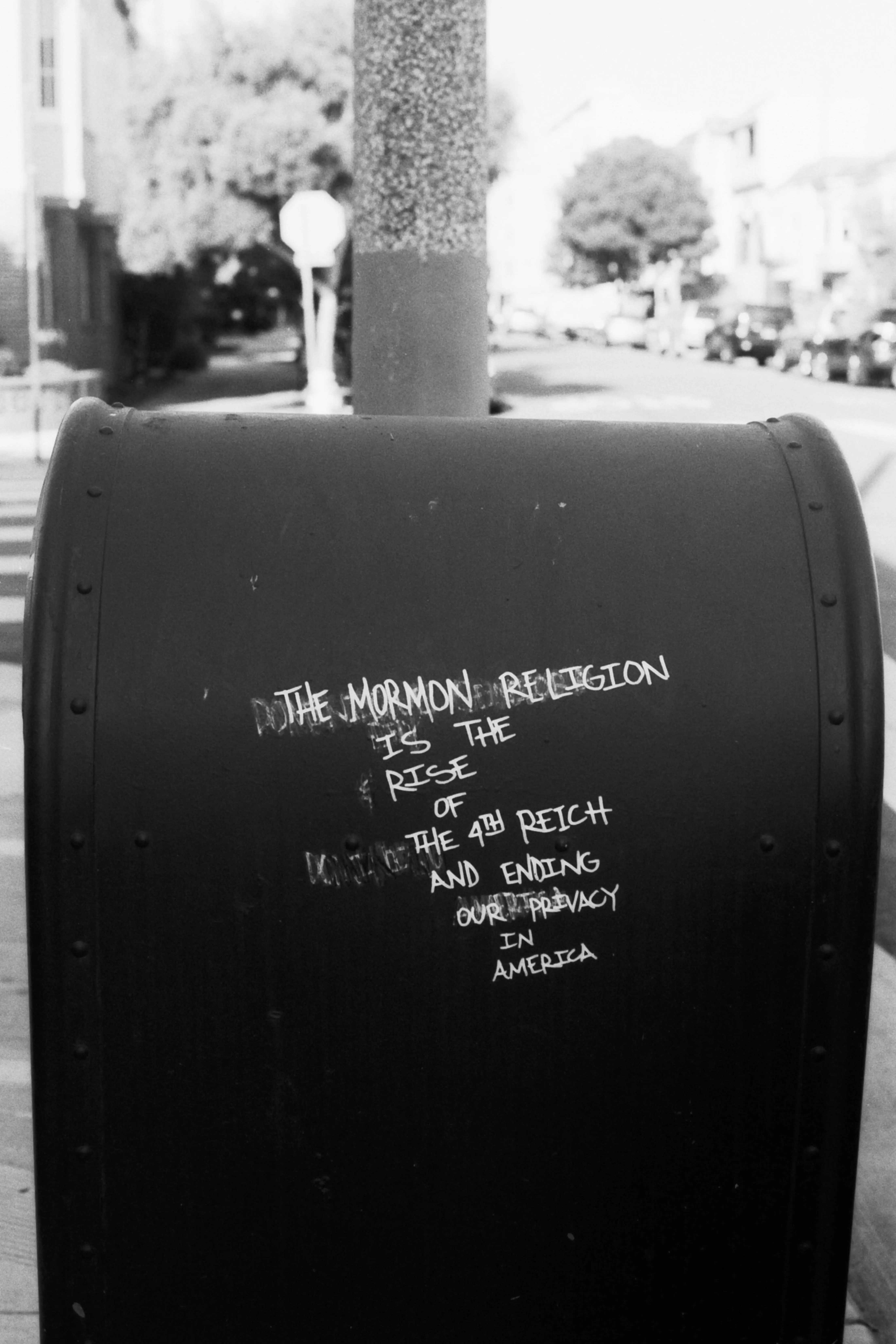 A photo of a mailbox that says "mormonism is the rise of the 4th Reich"